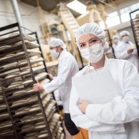 Woman Working At A Food Factory