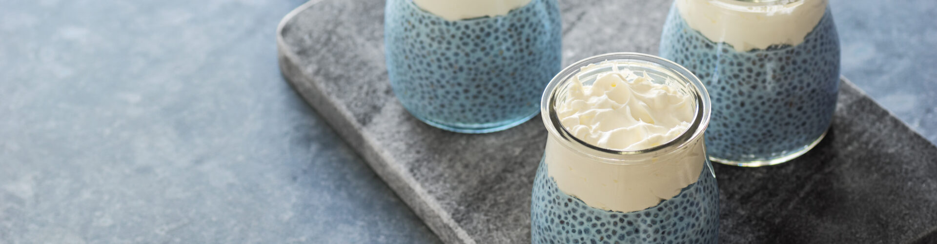 vegan blue spirulina chia puddings with whipped coconut cream