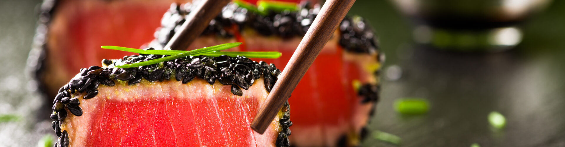 fried tuna steak in black sesame with chopsticks